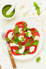Delicious salad of tomato, mozzarella and pesto.