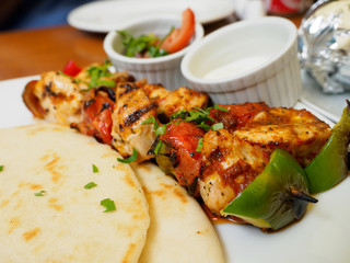Souvlaki or kebab, grilled meat skewer and pita bread