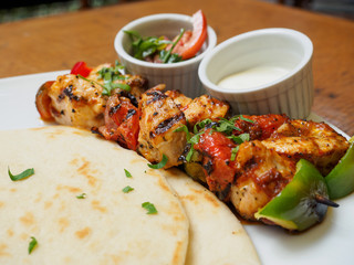 Souvlaki or kebab, grilled meat skewer and pita bread
