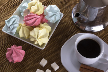 Meringue Cookies and cup of coffee.