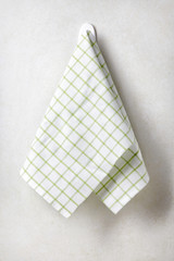Clean and soft towel hanging at bathroom wall