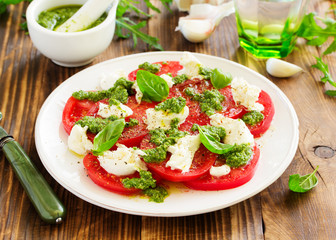 Delicious salad of tomato, mozzarella and pesto.