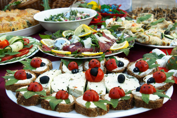 Variety of colorful appetizers on a festive table. Food prepared by Montenegrin housewives for the gastronomic holiday Žućenica fest. Festival in Tivat, Montenegro.