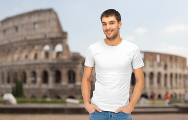 happy man in blank white t-shirt over coliseum