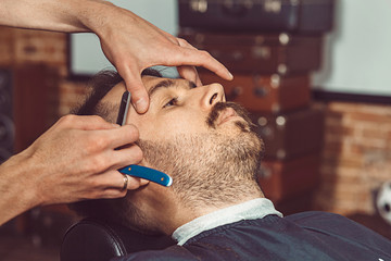 Hipster client visiting barber shop