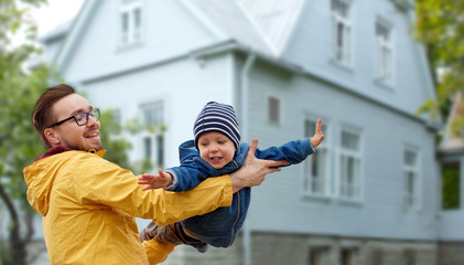 father with son playing and having fun outdoors