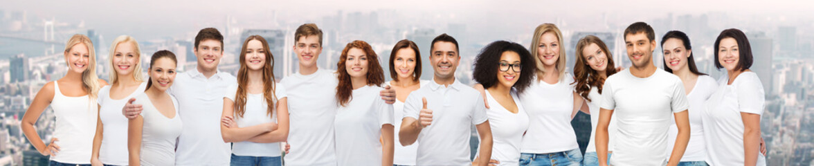 group of happy different people in white t-shirts