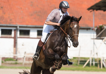 Young man riding a horse