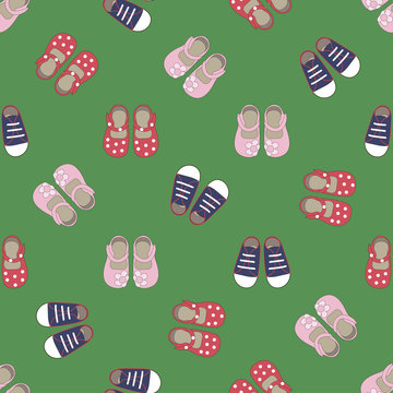 Kids seamless pattern with colored shoes on green background