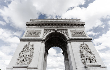 Fototapeta na wymiar Triumphal arch. Paris. France. View of Place Charles de Gaulle. Famous touristic architecture landmark in summer day. Napoleon victory monument. Symbol of french glory. World historical heritage.