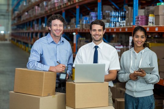 Worker team is posing and smiling to the camera