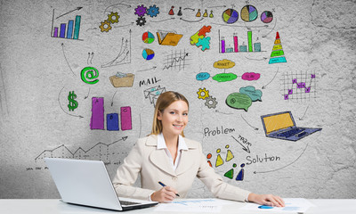 Elegant businesswoman sitting at table