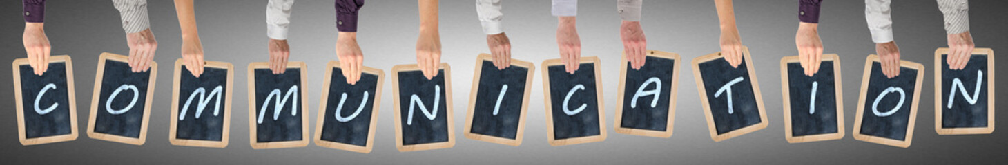 Letters of the word communication written on chalkboards