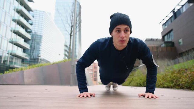 Doing push-ups and listening to music