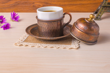 A cup of coffee with flowers