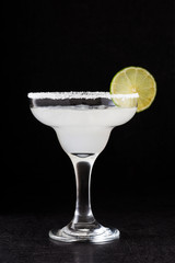 Margarita cocktai on black background

