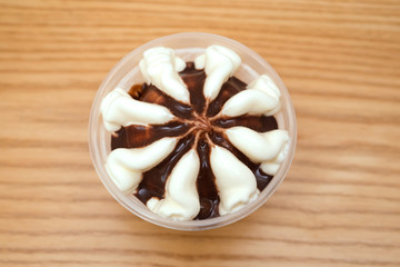 top view cup of chocolate flavor ice cream cone on wood table