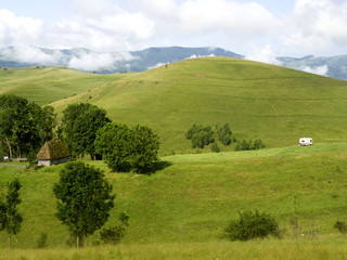 Fototapeta na wymiar Mountain landscape with camper 