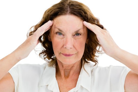 Portrait of unhappy mature woman having headache