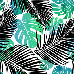 Seamless repeating pattern with silhouettes of palm tree leaves background.