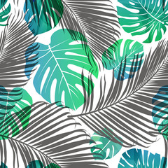 Seamless repeating pattern with silhouettes of palm tree leaves background.