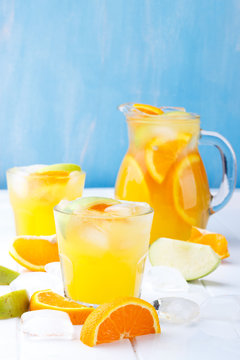 Refreshing lemonade with oranges and apple