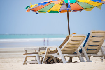 beach chair with colorful umbrella