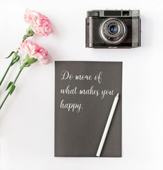 Vintage camera and pink flower with motivational sample text