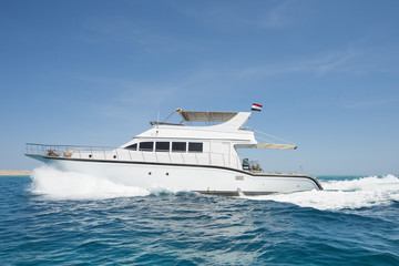 Luxury motor yacht sailing on tropical sea