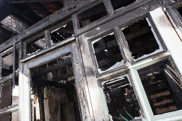burned-down wooden house