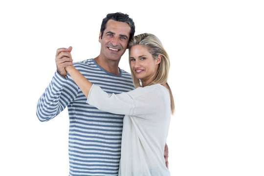 Couple dancing against white background