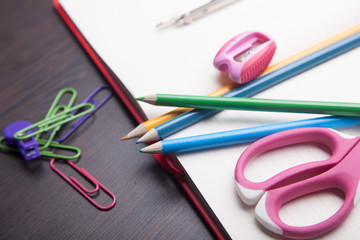 school supplies on black