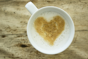 heart appearing in a cup of coffe
