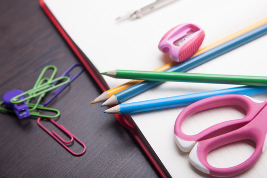 school supplies on black