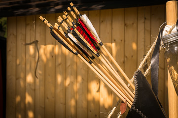 A leather quiver with arrows in it.