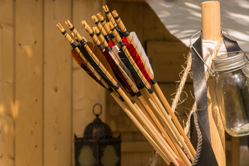 A leather quiver with arrows in it.