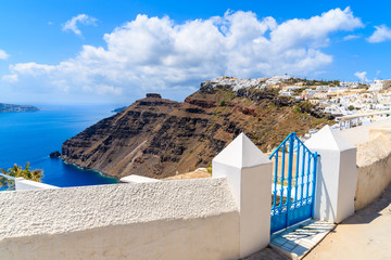 A street in Firostefani village with view of caldera and sea, Santorini island, Greece