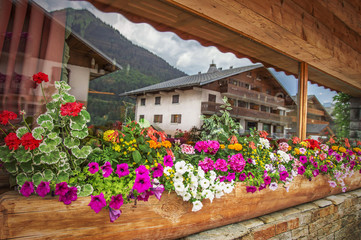 Fototapeta na wymiar Tourism background. French house in the Alps