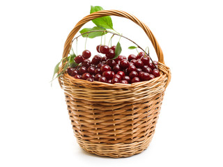 Basket full of fresh red cherry on a white background