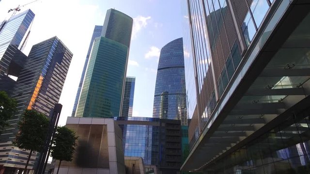 Urban skyscrapers from moving dolly (slow motion)
