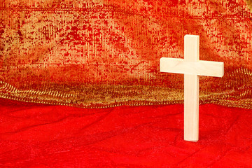 Wood cross on royal red background
