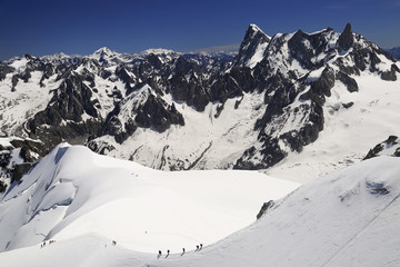 Fototapeta na wymiar Climbers on French Alps Mountains near Aiguille du Midi, France, Europe