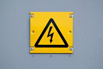 European yellow lightning sign of high voltage. Warning about dangerous electricity