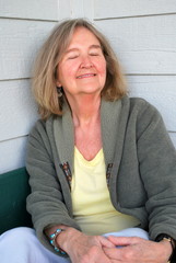Mature female blond beauty expressions outside.