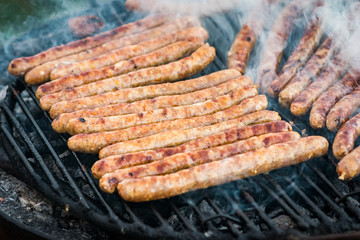 Meat sausages roasted on the grill