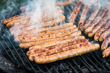 Meat sausages roasted on the grill
