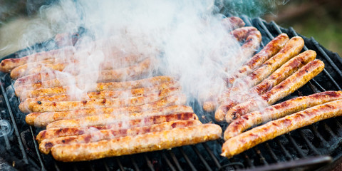 Meat sausages roasted on the grill