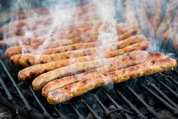 Meat sausages roasted on the grill