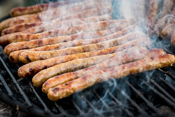 Meat sausages roasted on the grill
