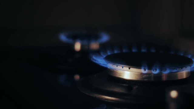 Gas burners of a stove [slide motion]
